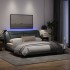 Estructura de cama con luz LED tela gris oscuro 180x200