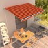 Toldo automático retráctil naranja y marrón 450x300