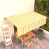 Toldo automático retráctil con persiana amarillo y blanco 6x3