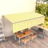 Toldo retráctil manual con persiana amarillo y blanco 6x3